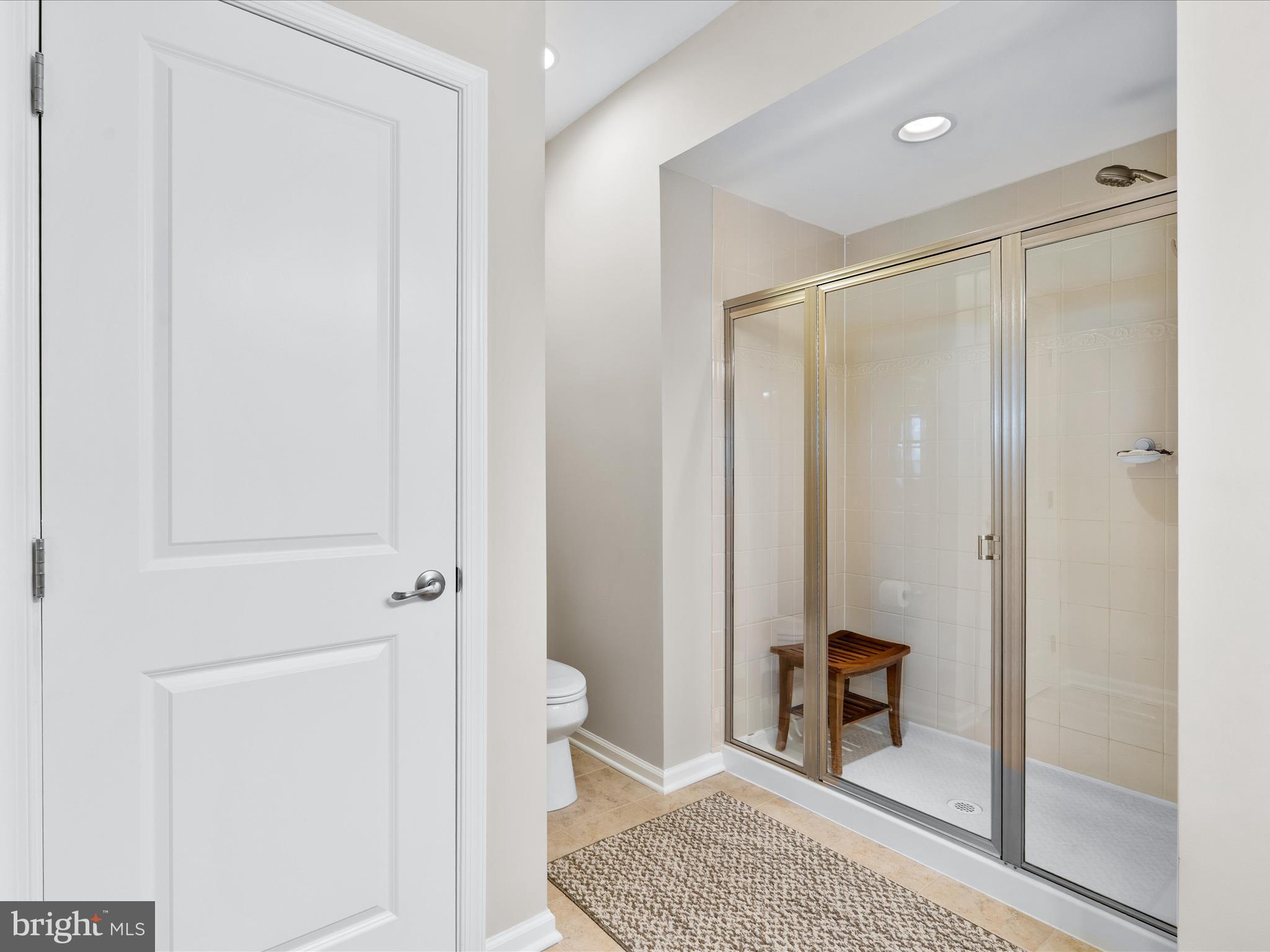 5039 Small Gains Way Frederick, MD 21703 - Photo 6 of 34 a bathroom with a shower and a toilet