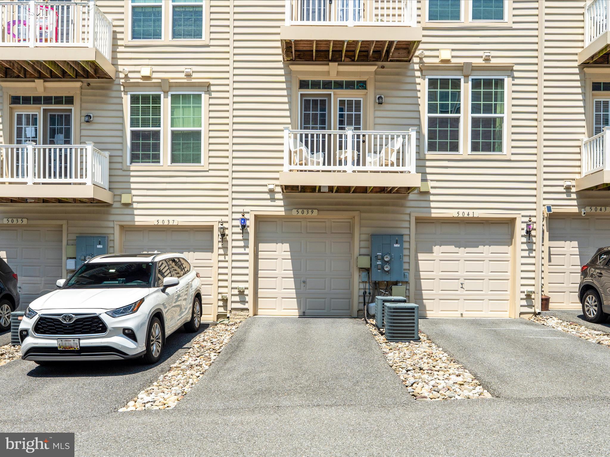 5039 Small Gains Way Frederick, MD 21703 - Photo 7 of 34 a view of a car parked in front of a house