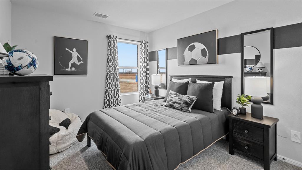 176 Mojave Road Boyd, TX 76023 - Photo 25 of 40 a bedroom with a bed and painting on the wall