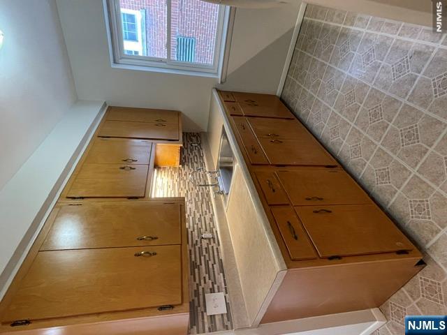279 Chestnut Street Nutley, NJ 07110 - Photo 5 of 9 a kitchen with a sink cabinets and window