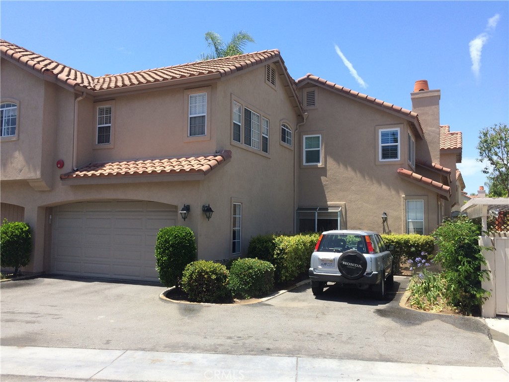 2371 Tryall Tustin, CA 92782 - Photo 2 of 18 a view of a house with a yard and sitting area