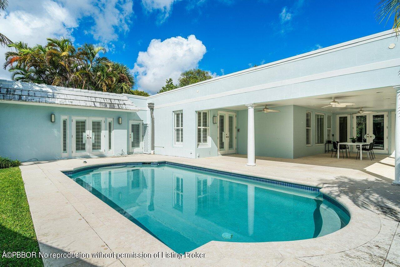 256 Mockingbird Trail Palm Beach, FL 33480 - Photo 23 of 25 a view of swimming pool with outdoor seating