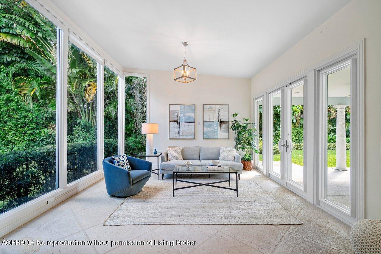 256 Mockingbird Trail Palm Beach, FL 33480 - Photo 5 of 25 a living room with furniture and a potted plant