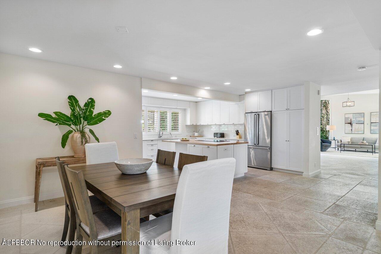 256 Mockingbird Trail Palm Beach, FL 33480 - Photo 9 of 25 a kitchen with a table and chairs