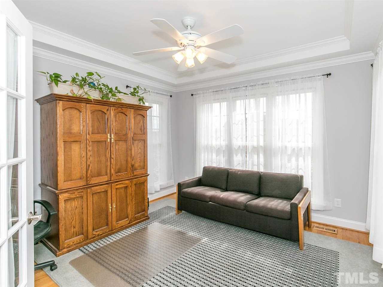 1832 Stannard Trail Raleigh, NC 27612 - Photo 15 of 25 Downstairs bedroom features hardwoods, lots of light, French door entry. Currently used as an office. Bedroom