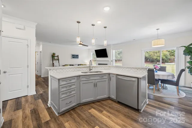a kitchen with a sink cabinets and window