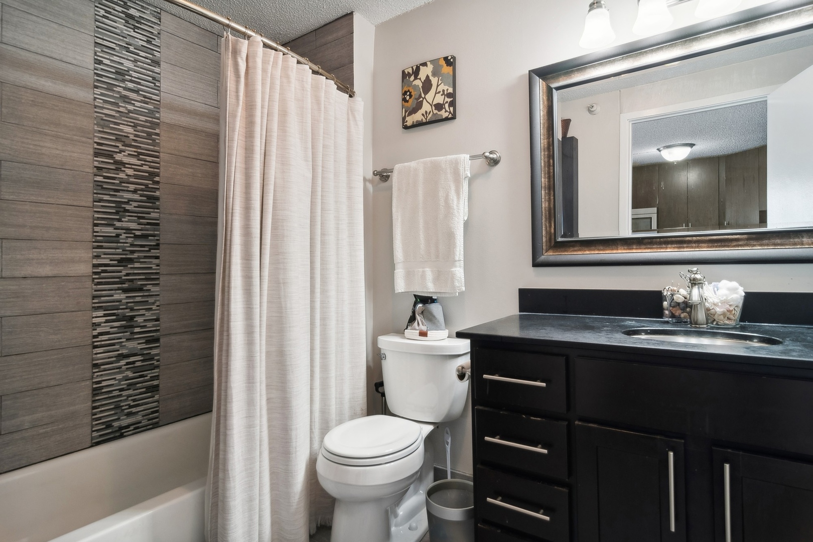 545 North Dearborn Street, Unit 2610 Chicago, IL 60654 - Photo 11 of 37 a bathroom with a sink a toilet and a large mirror
