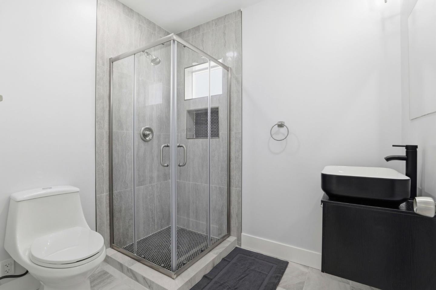 1802 Ponca Court Fremont, CA 94539 - Photo 21 of 28 a bathroom with a shower a toilet and a sink