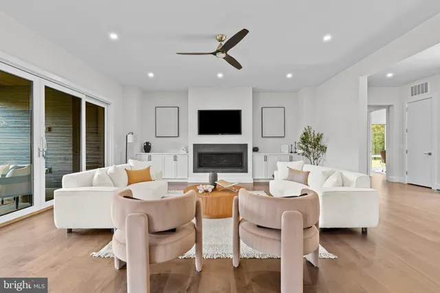 a bathroom with a granite countertop sink and a window