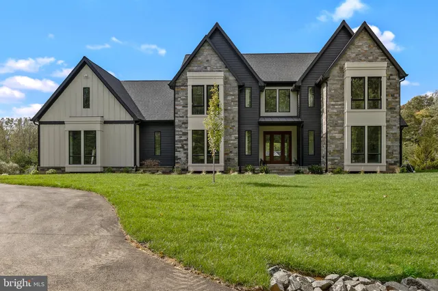 a dining room with furniture window and wooden floor