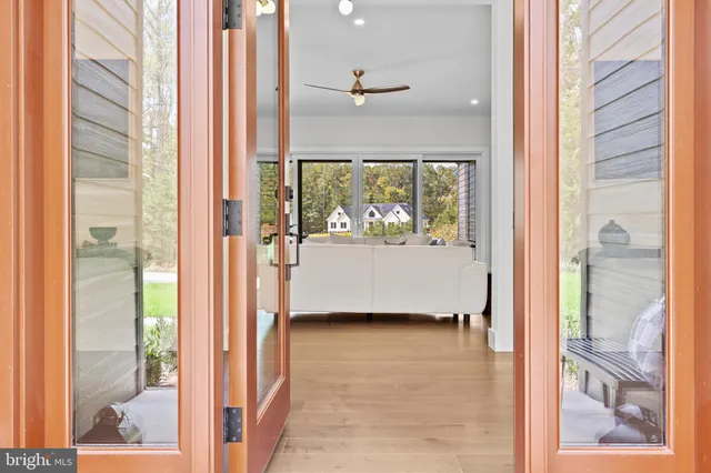 a kitchen with kitchen island a chandelier and wooden cabinets