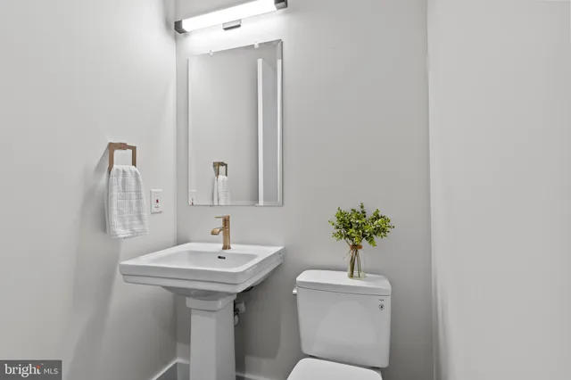 a living room with hard wood floors and a wooden floor