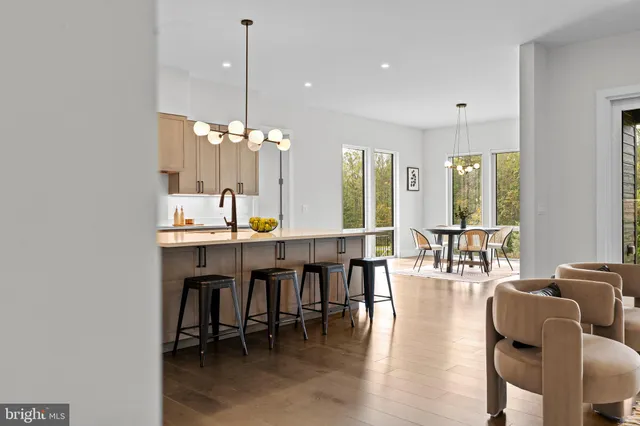 a kitchen with a stove a refrigerator and a sink