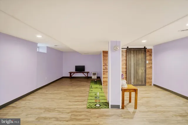 a view of a room with a rug and a window