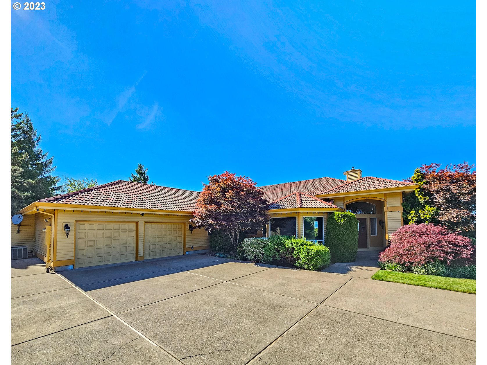 34220 Southwest Firdale Road Cornelius, OR 97113 - Photo 2 of 10 a front view of a house with a yard and garage