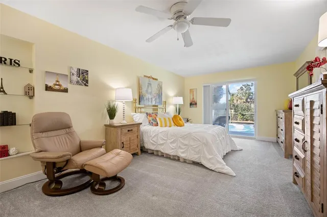 a bedroom with furniture and a window