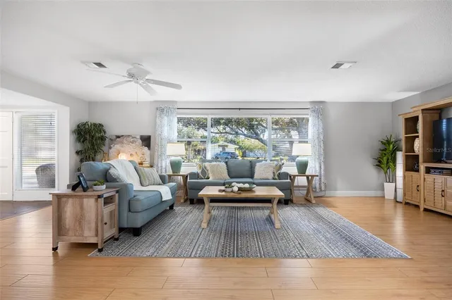 a living room with furniture and a large window