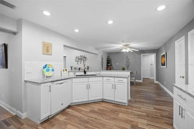 a spacious bathroom with a sink and a mirror