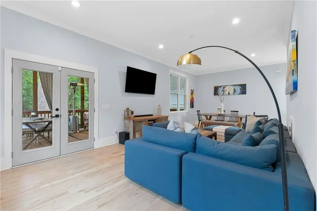 a bedroom with bed and a chandelier
