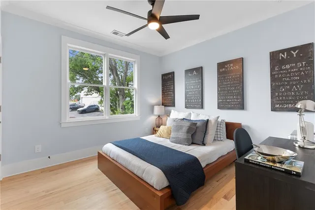 a bathroom with a bathtub sink mirror toilet and shower