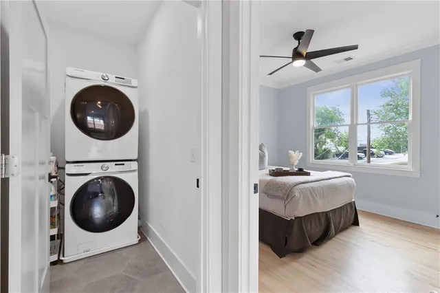 a close view of a utility room with dryer and washer