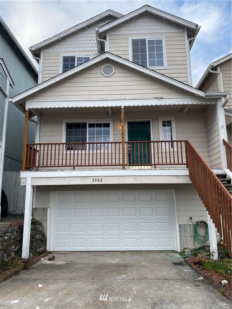 3966 Broadmoor Loop Bremerton, WA 98310 - Photo 1 of 32 a front view of a house with garage