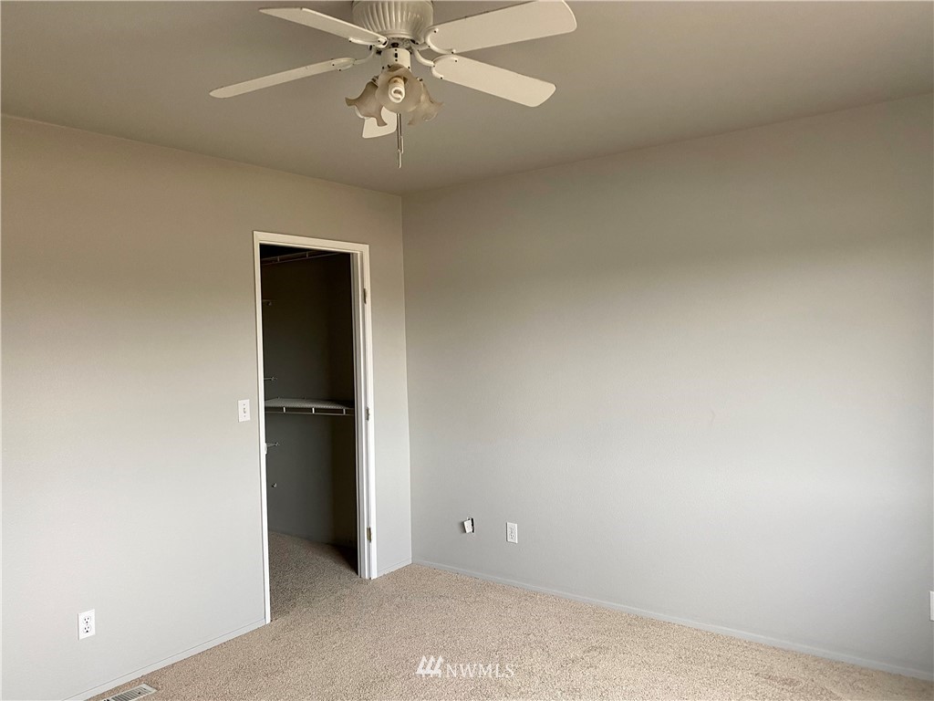 3966 Broadmoor Loop Bremerton, WA 98310 - Photo 20 of 32 an empty room with chandelier fan