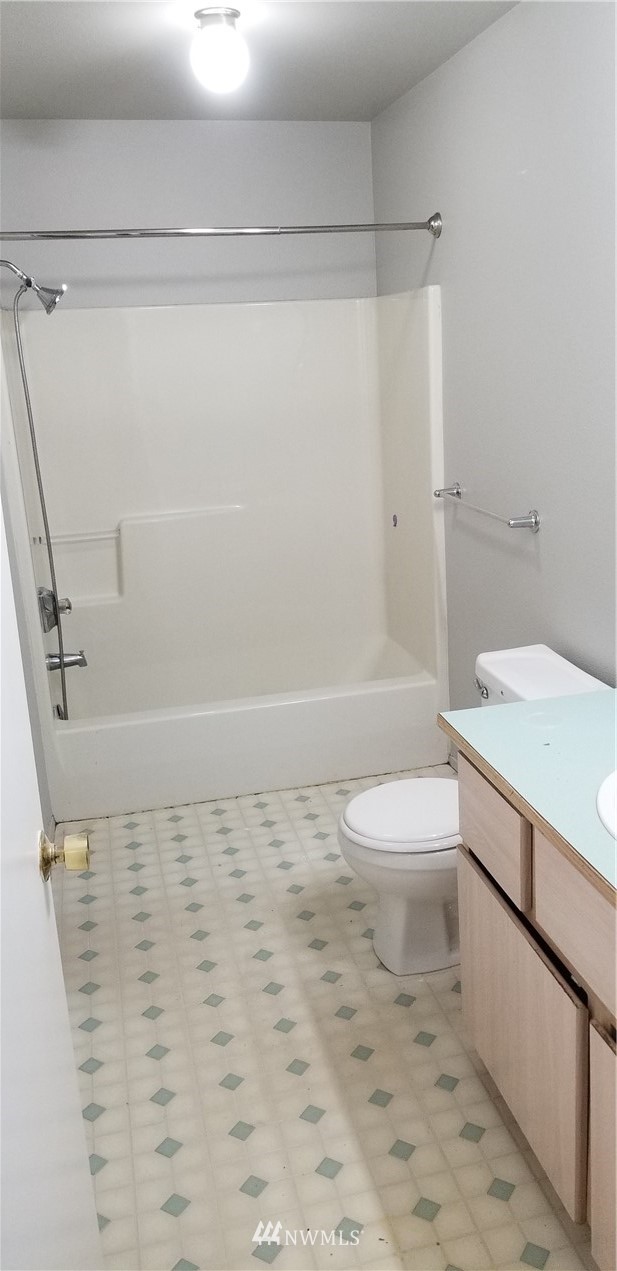 3966 Broadmoor Loop Bremerton, WA 98310 - Photo 22 of 32 a bathroom with a toilet a sink and shower