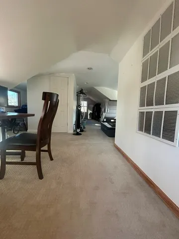 a view of workspace with furniture and windows