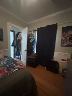 a bedroom with a bed and a closet