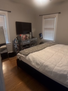 634 Spring Road Elmhurst, IL 60126 - Photo 14 of 15 a bedroom with a bed and a flat screen tv