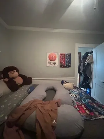 a bedroom with a bed and a walk in closet