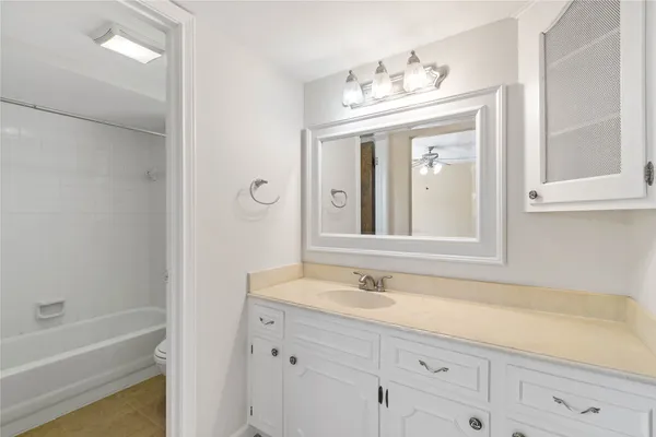 a bathroom with a sink double vanity and a mirror