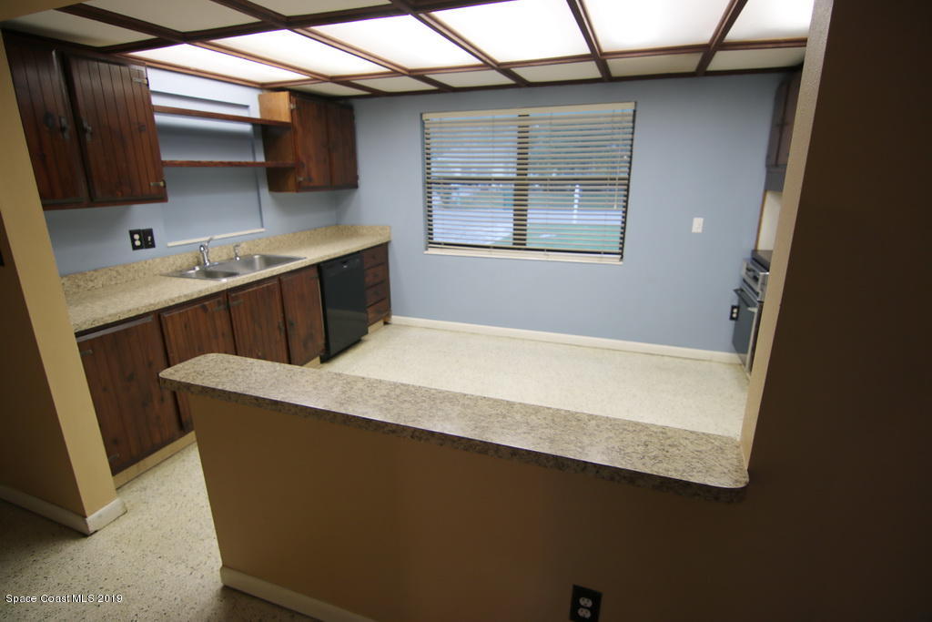 945 Trinidad Road Cocoa Beach, FL 32931 - Photo 13 of 34 a room with closet and window
