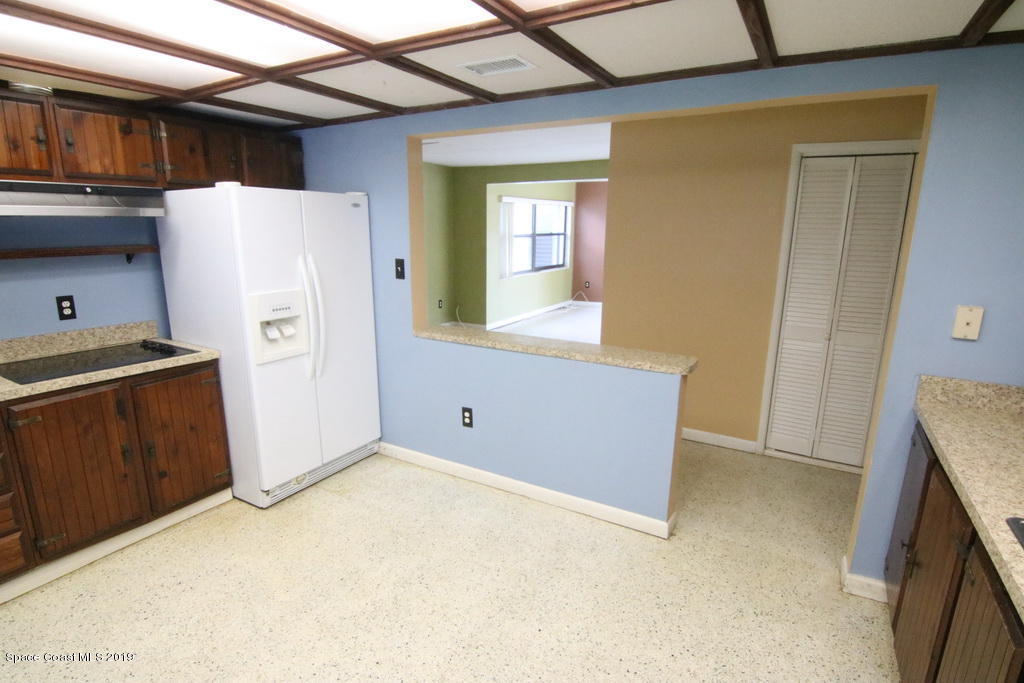 945 Trinidad Road Cocoa Beach, FL 32931 - Photo 14 of 34 a view of kitchen with utility room
