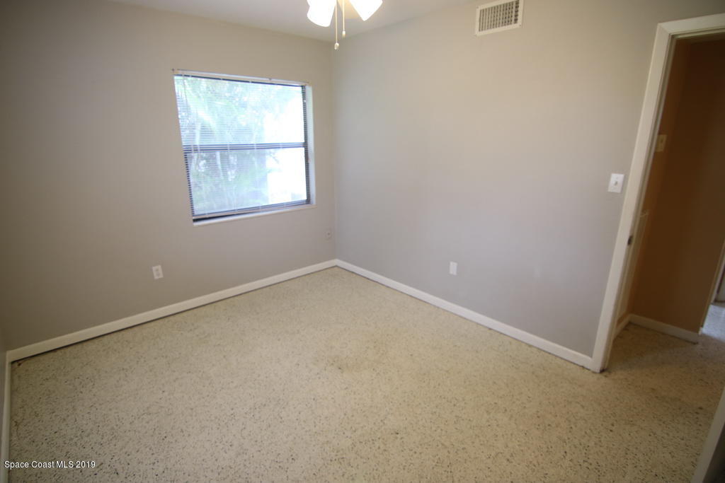 945 Trinidad Road Cocoa Beach, FL 32931 - Photo 16 of 34 an empty room with a window