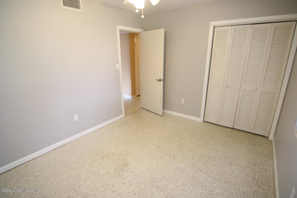945 Trinidad Road Cocoa Beach, FL 32931 - Photo 17 of 34 an empty room with closet area