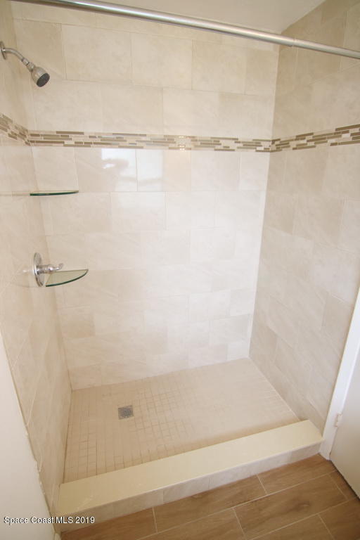 945 Trinidad Road Cocoa Beach, FL 32931 - Photo 21 of 34 a bathroom with a shower