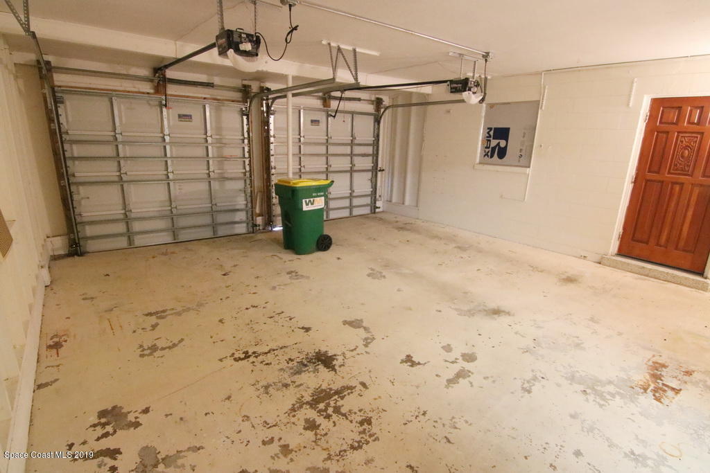 945 Trinidad Road Cocoa Beach, FL 32931 - Photo 22 of 34 a view of a garage