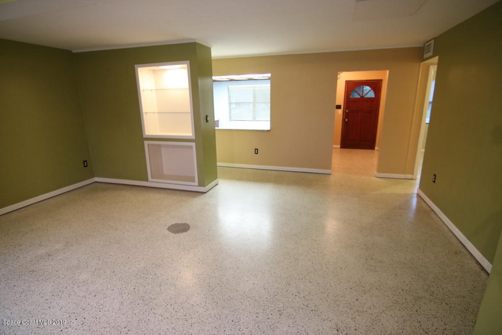 945 Trinidad Road Cocoa Beach, FL 32931 - Photo 7 of 34 an empty room with windows