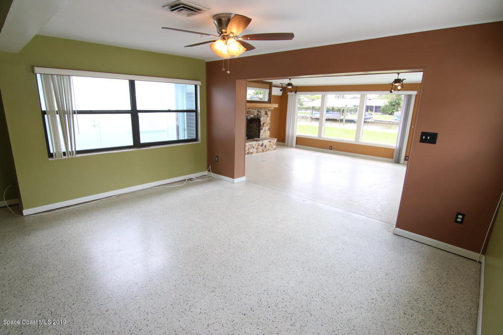 945 Trinidad Road Cocoa Beach, FL 32931 - Photo 10 of 34 a view of an empty room with a window