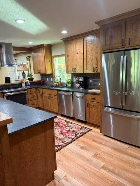 503 Bear Road Lake Placid, FL 33852 - Photo 12 of 29 a kitchen with stainless steel appliances granite countertop a refrigerator sink dishwasher a stove and white cabinets with wooden floor