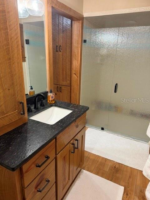 503 Bear Road Lake Placid, FL 33852 - Photo 23 of 29 a bathroom with a granite countertop sink a mirror and a bathtub