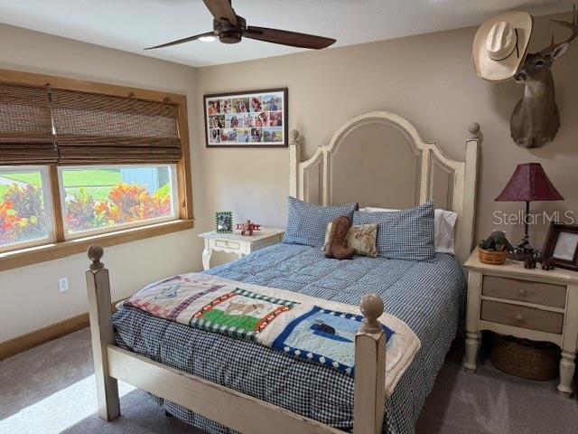 503 Bear Road Lake Placid, FL 33852 - Photo 25 of 29 a bedroom with a bed a dresser next to a window