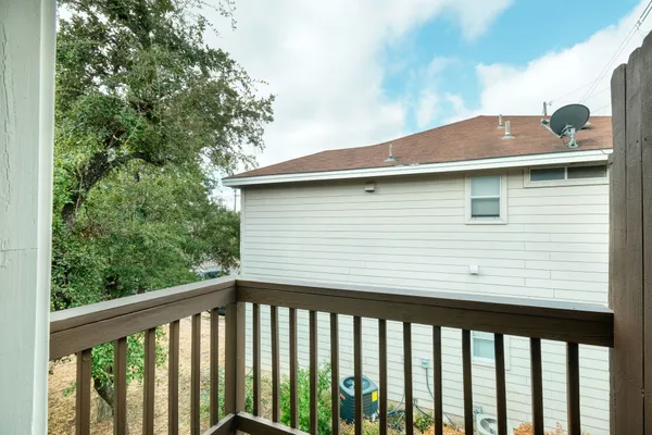 a side view of a house with a balcony