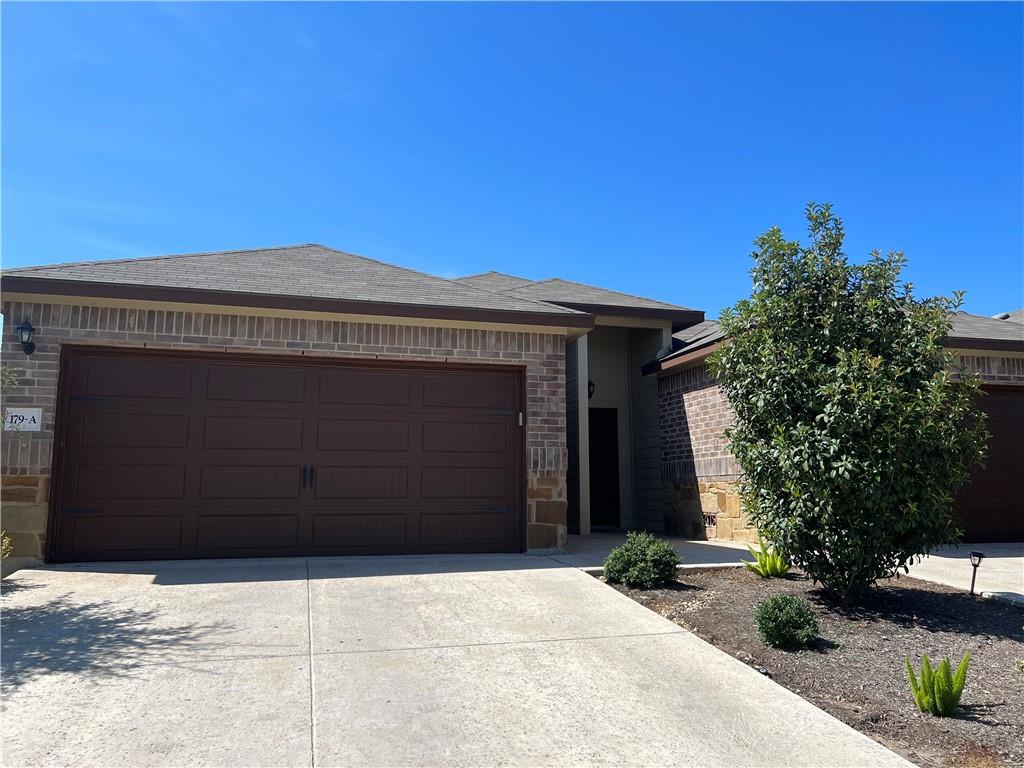 179 Joanne Loop, Unit A Buda, TX 78610 - Photo 1 of 1 a front view of a house