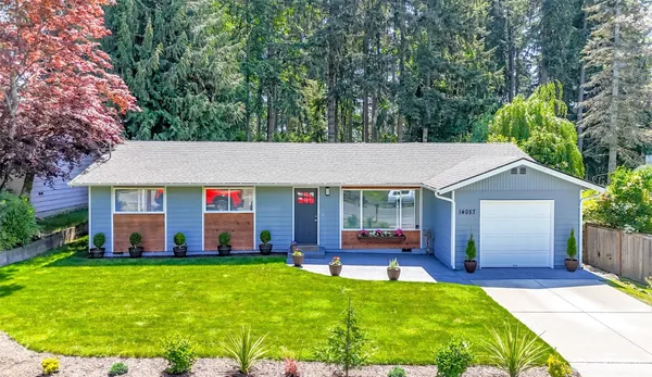 a front view of house with yard and outdoor seating