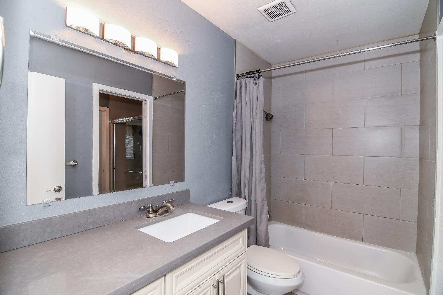1139 Rivara Circle Sacramento, CA 95864 - Photo 44 of 72 a bathroom with a granite countertop sink toilet and shower