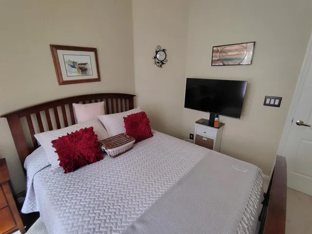 a bath tub sitting next to a white sink