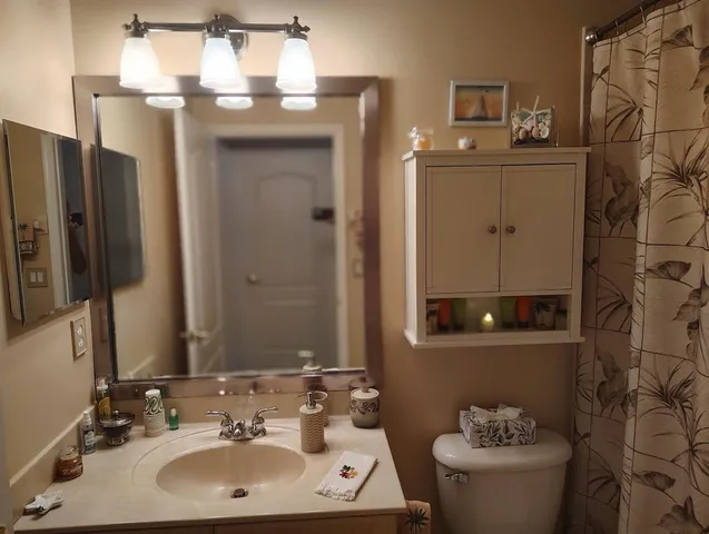 a bathroom with a bath tub with a shower